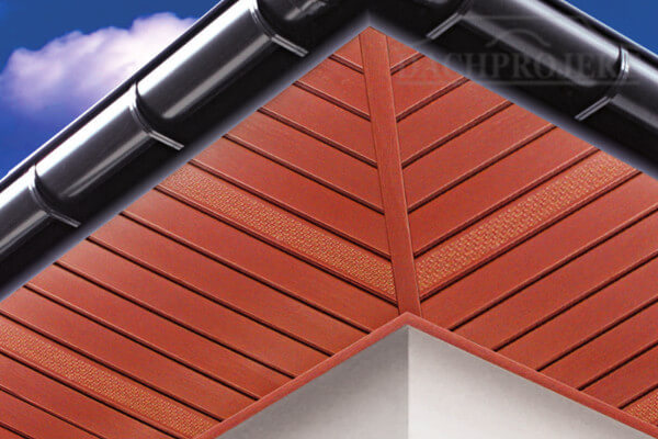 Zdjęcie przedstawia dolną część okapu wykończoną podbiką dachową Bryza w kolorze brązowym oraz orynnowanie w kolorze grafitowym